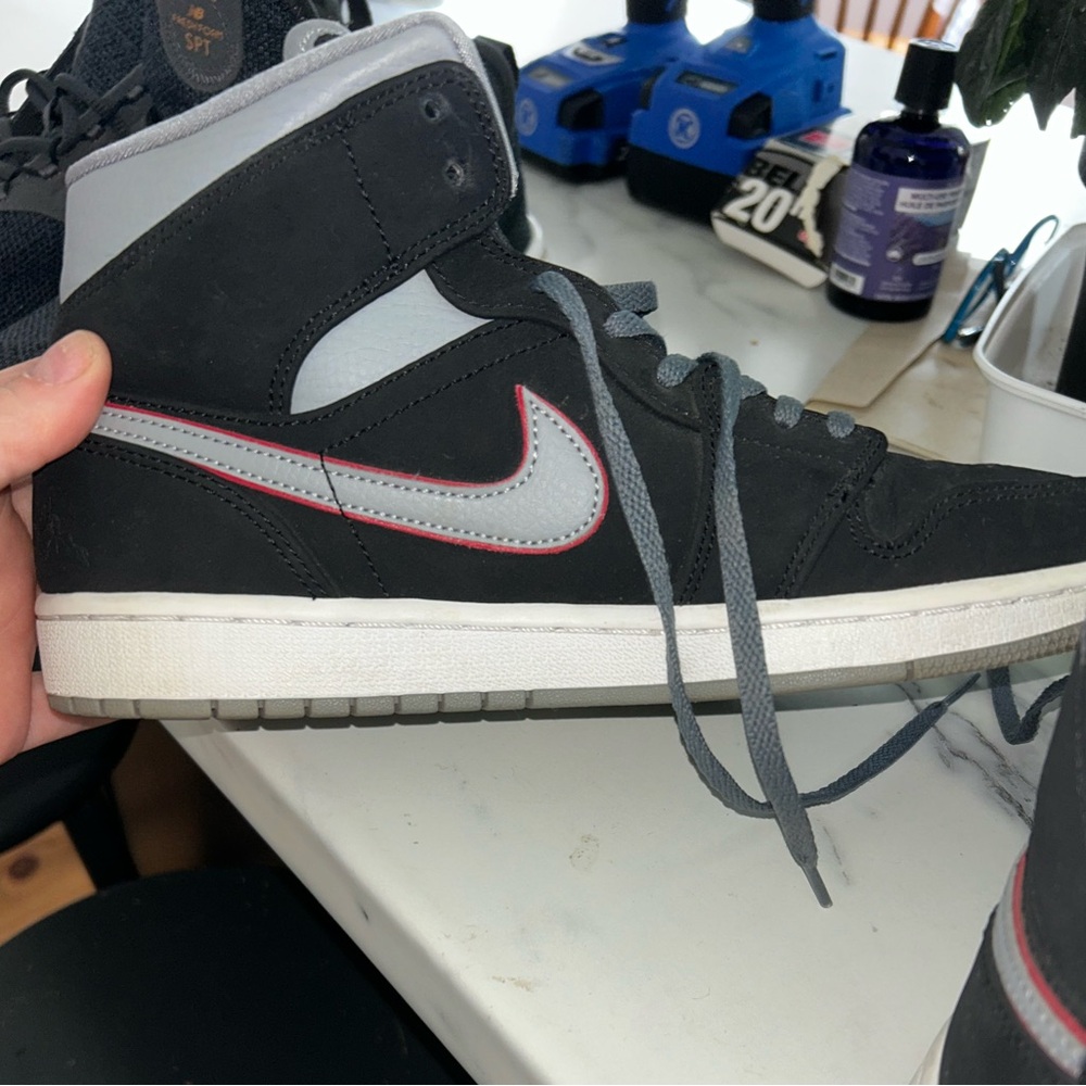 Nike air Jordan’s Black and Gray Sneakers with Red Accents